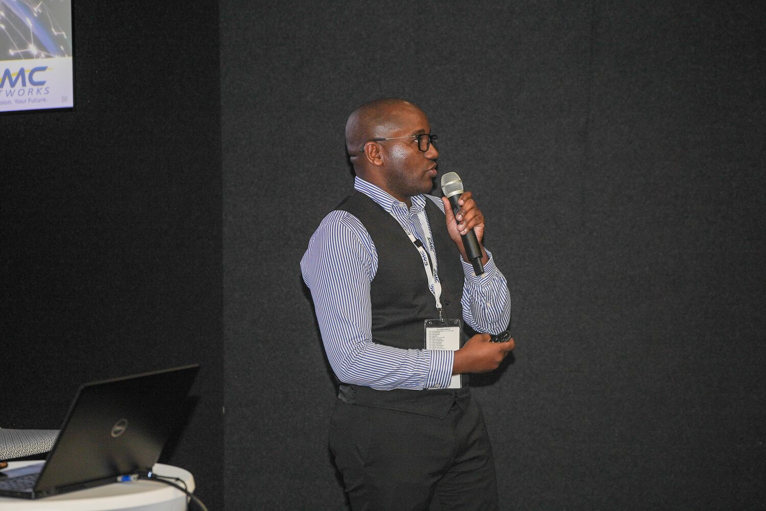 An employee addressing the room