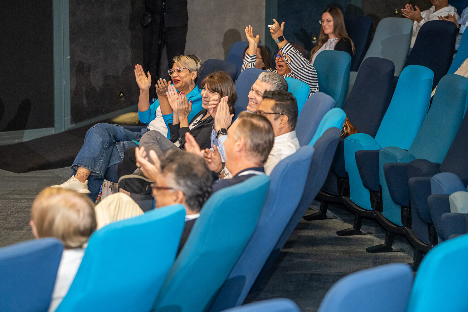Employees cheering during the 2026 conference