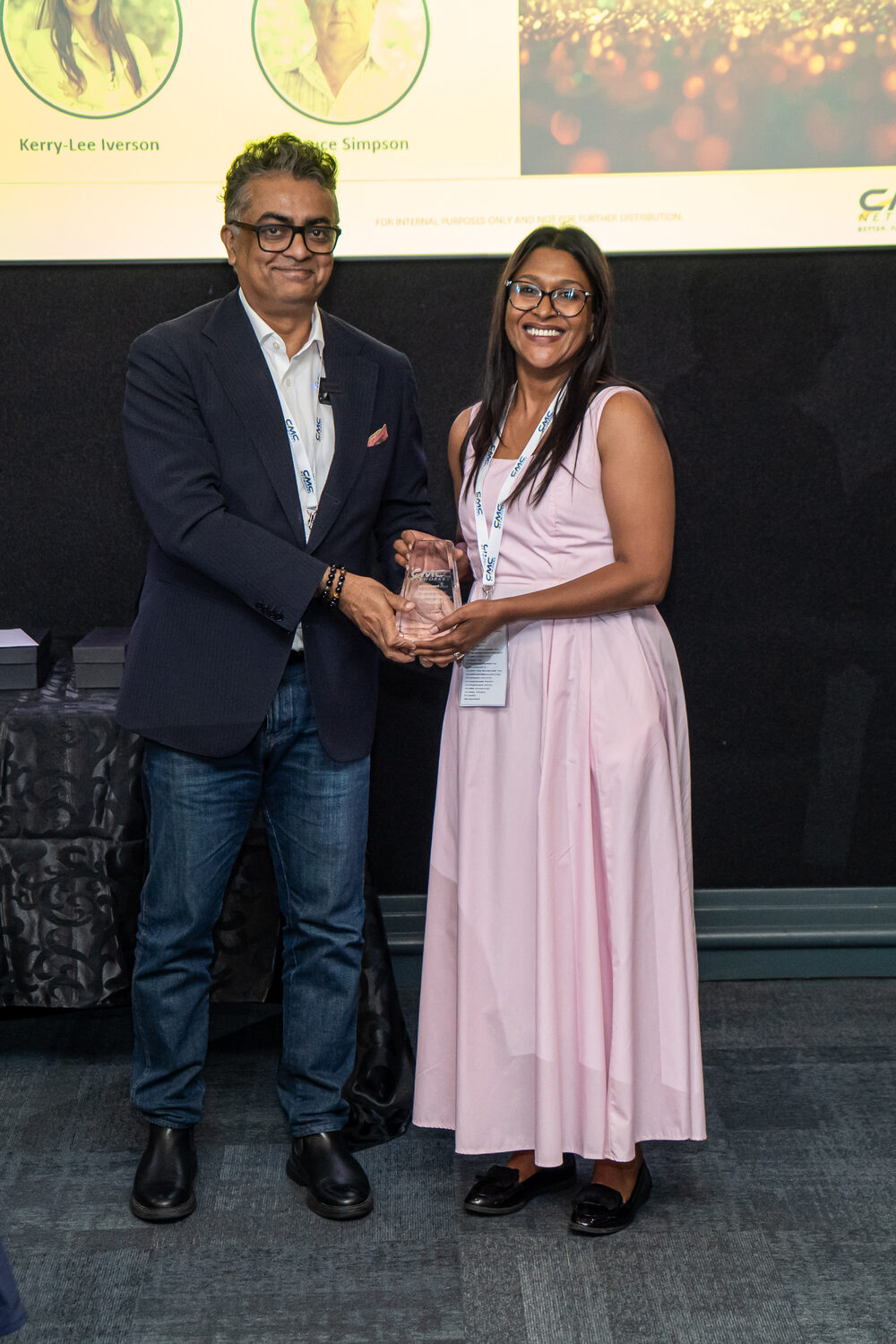 An employee receiving an award at the 2026 kick-off