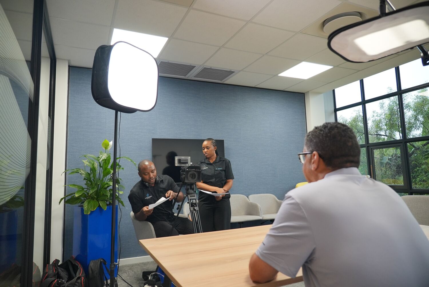 The consistent interview setup with softbox lighting at CMC Networks