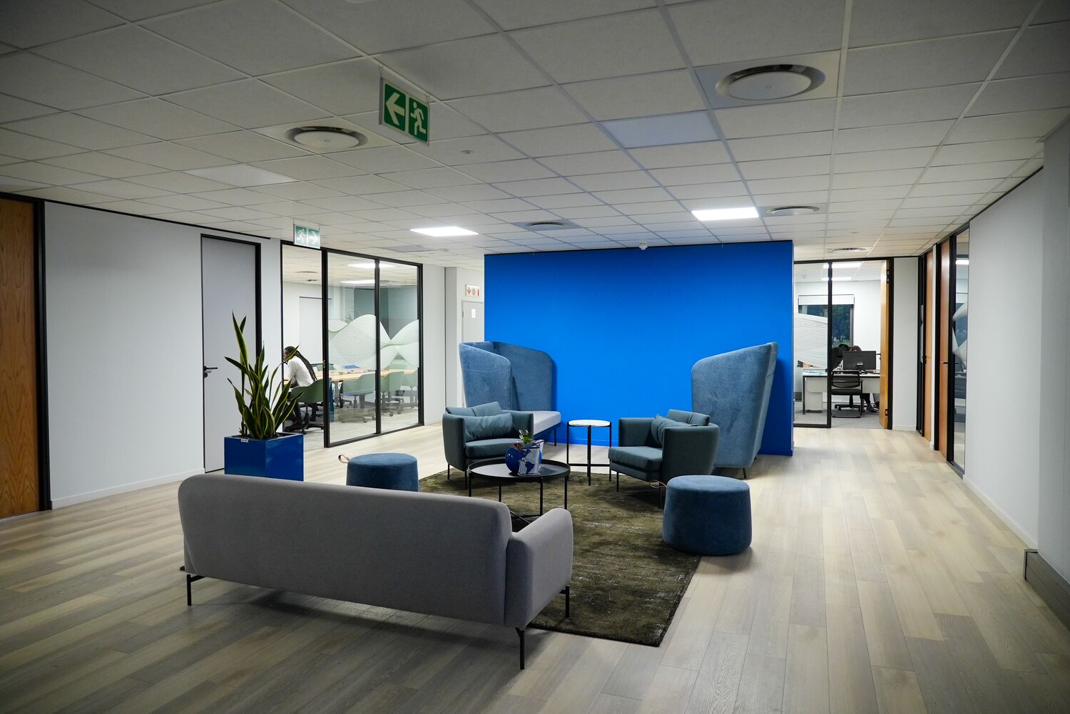 A waiting area with a blue accent wall