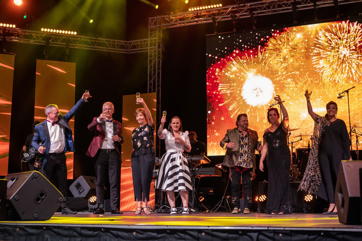 Leadership celebrating on stage at the finale