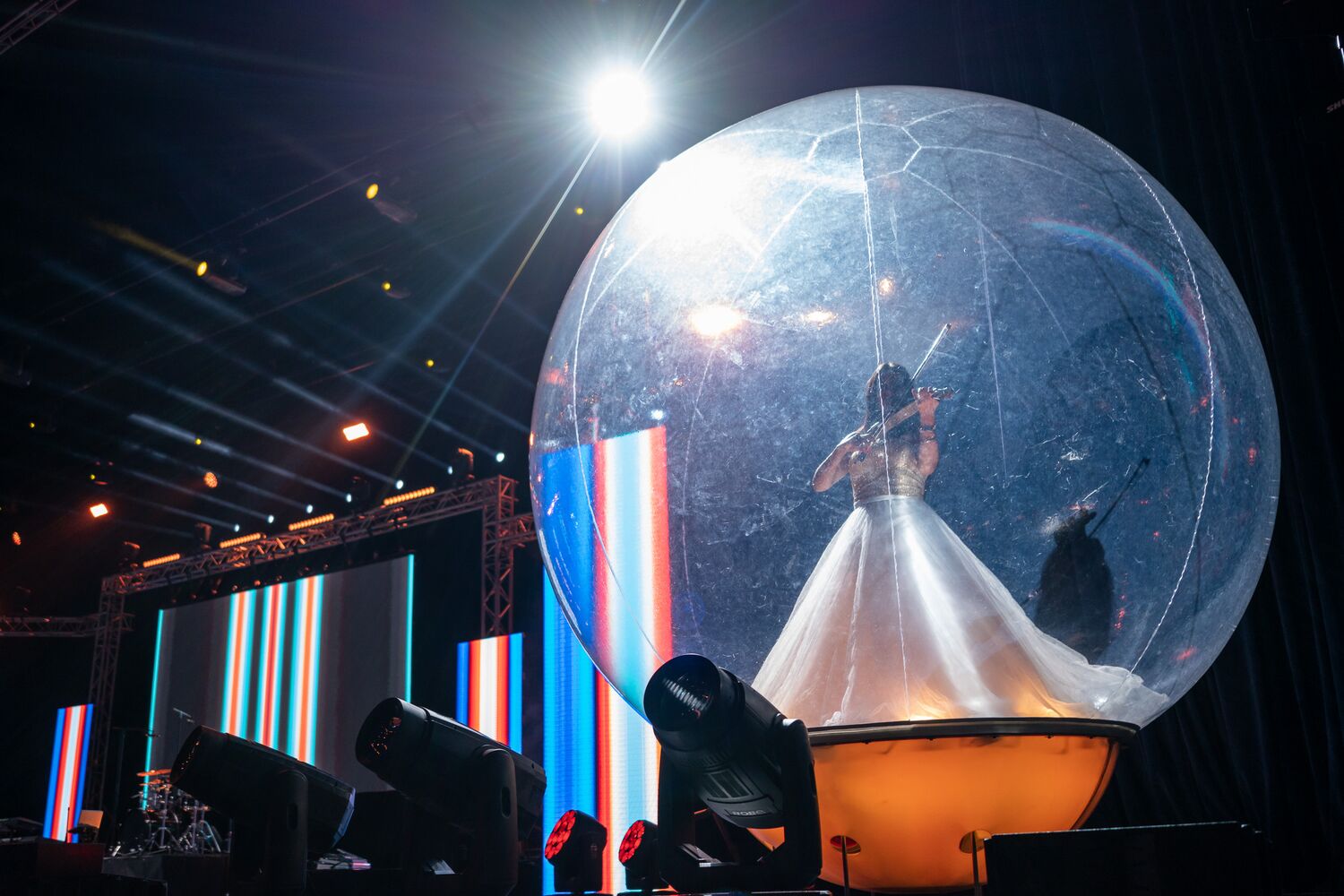 A performer inside a suspended sphere during the entertainment programme