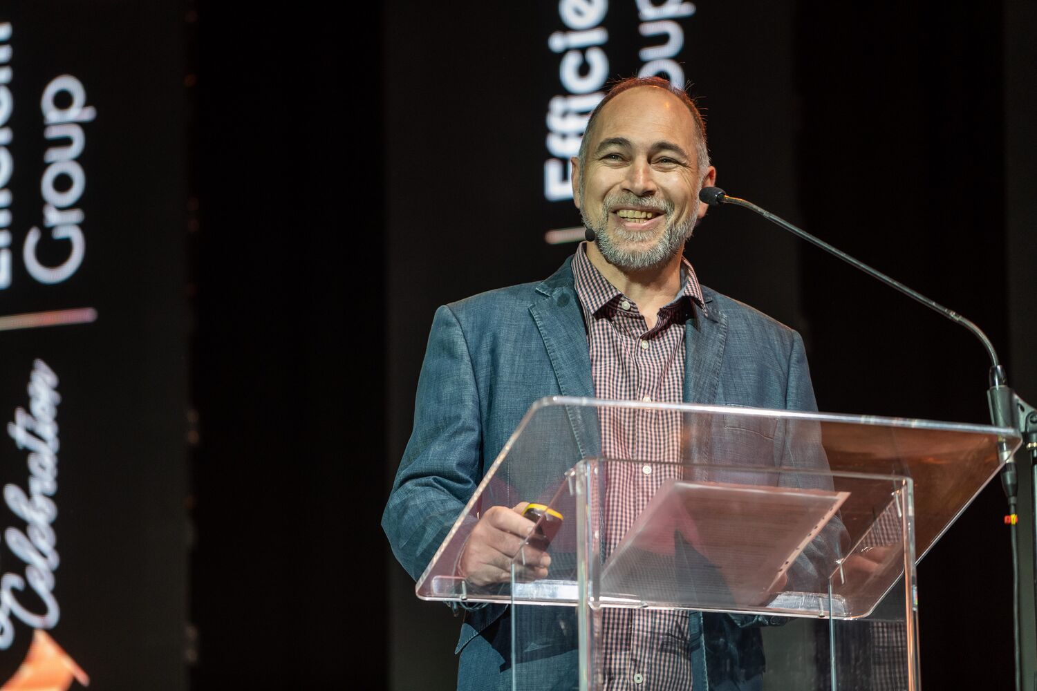 A speaker at the podium during the conference programme