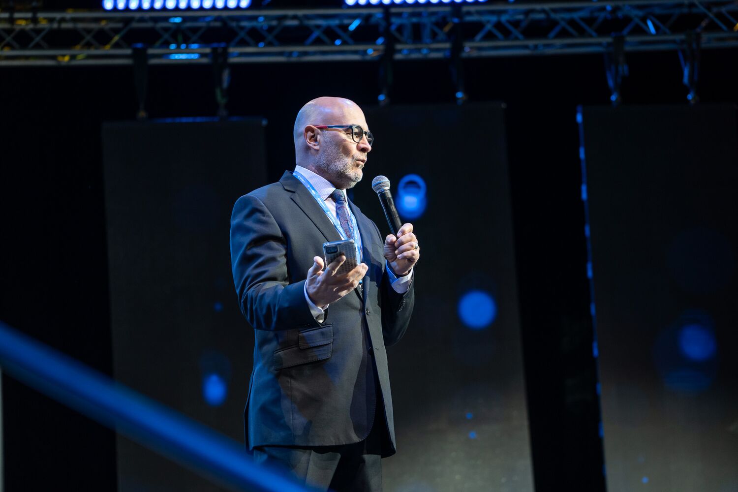 A speaker addressing delegates from the stage