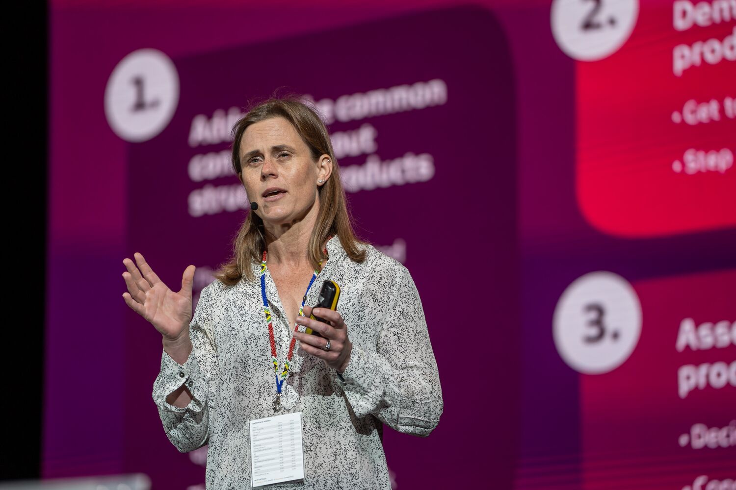 A speaker presenting alongside on-screen graphics