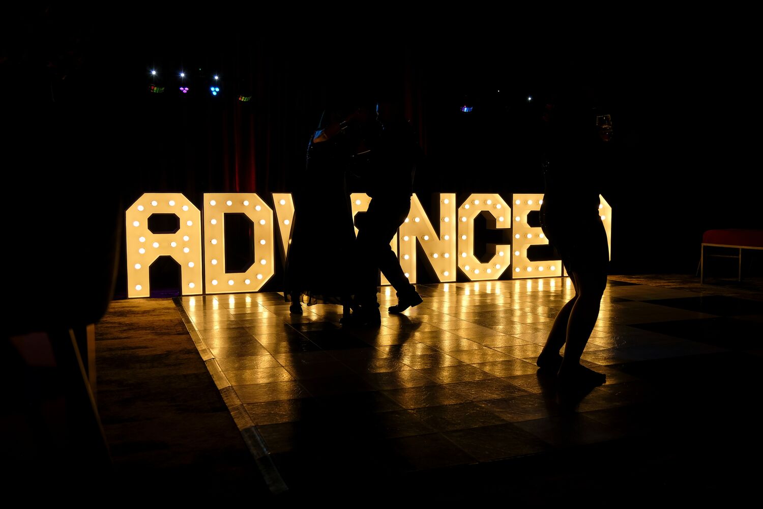 The dance floor and Advanced signage as the celebration begins