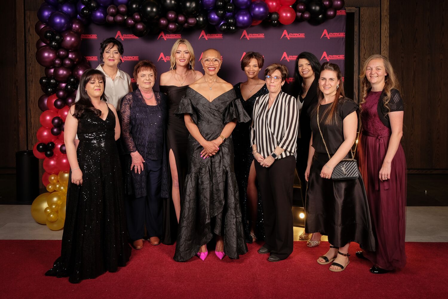 Team group photograph at the anniversary gala
