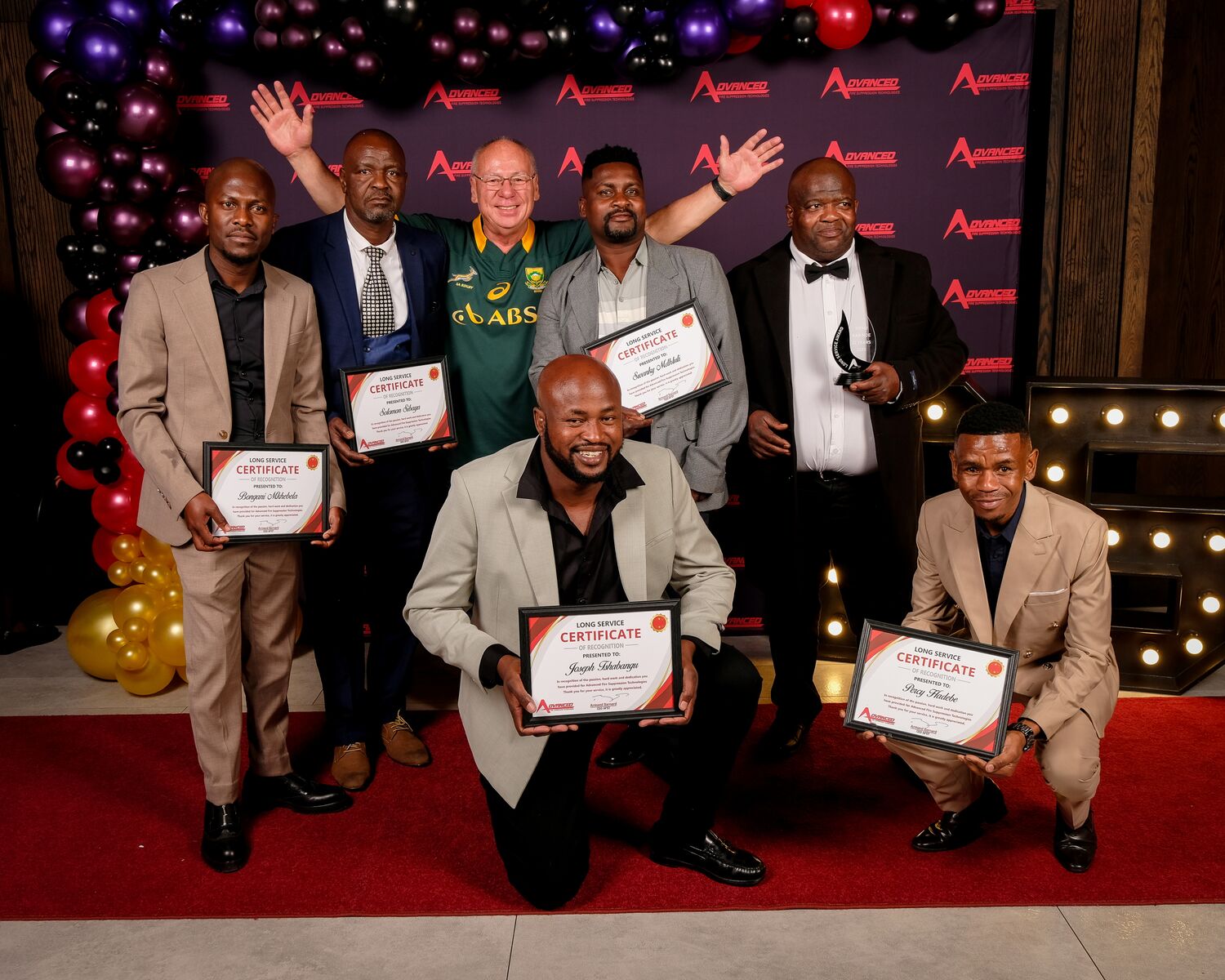 Award winners celebrating with their certificates