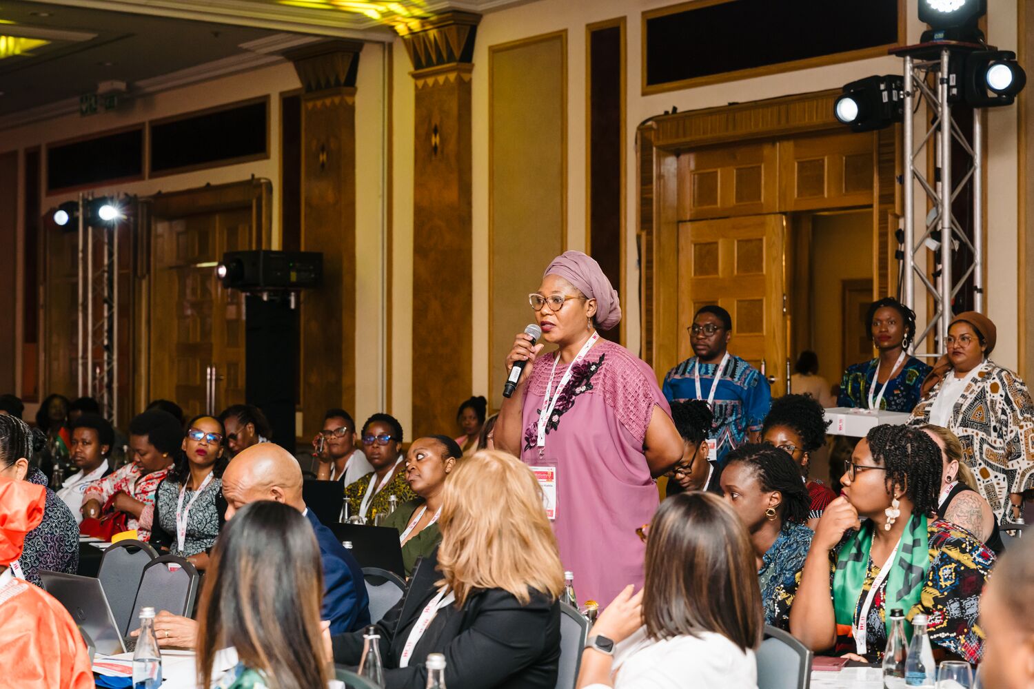 A delegate asking a question from the audience