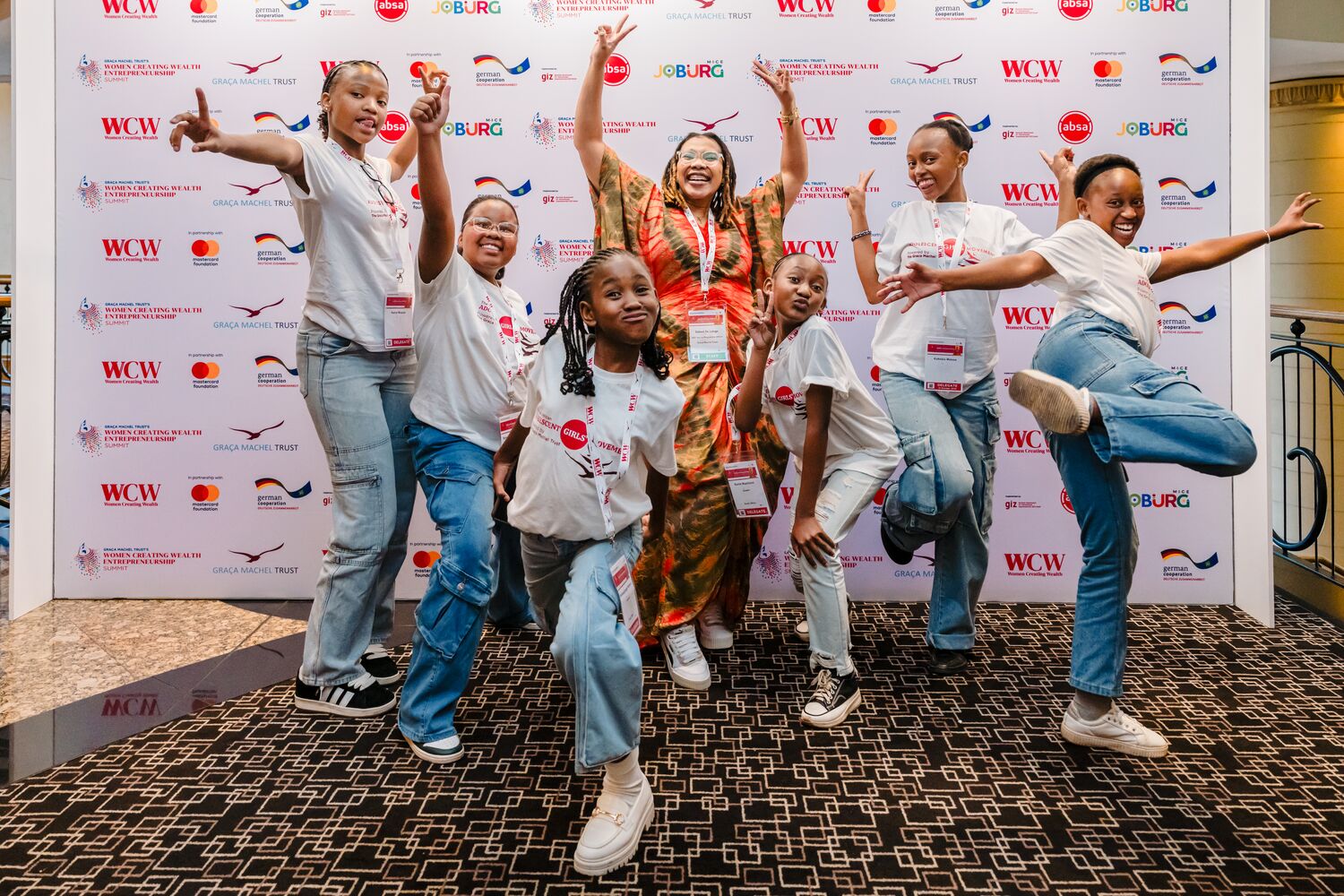 Delegates celebrating together at the summit