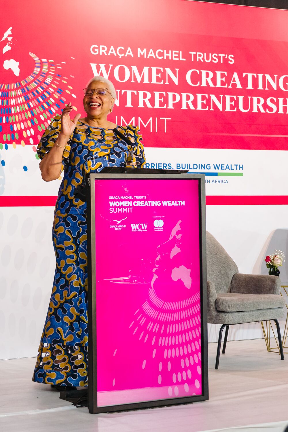 Speaker presenting from the summit podium