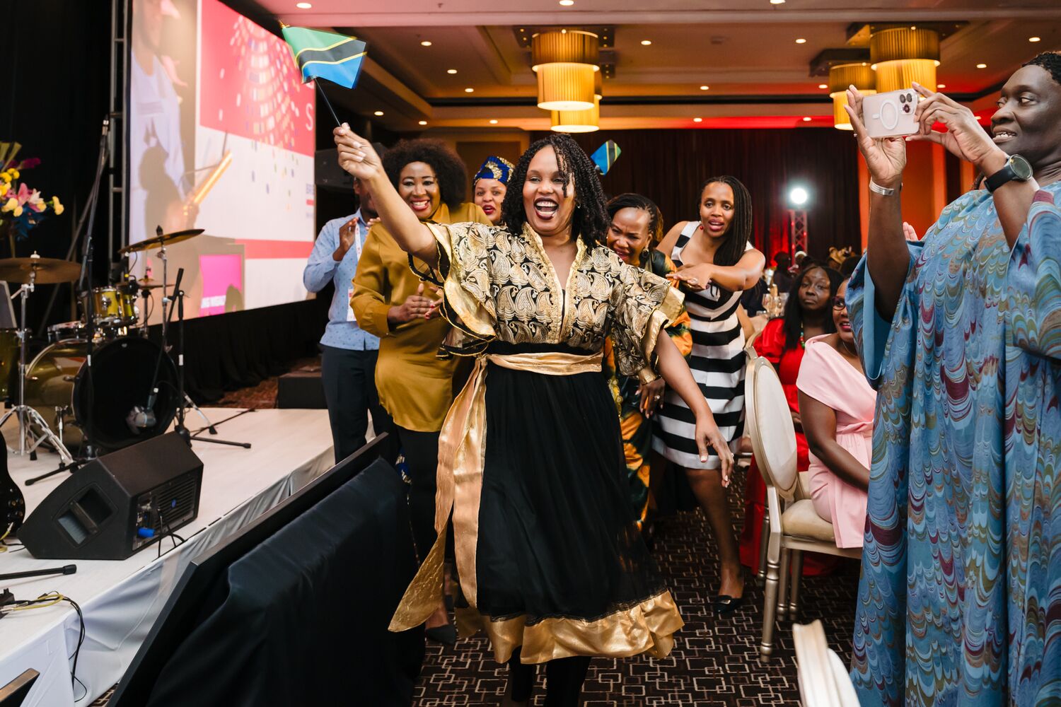 Delegates celebrating a memorable moment at the summit