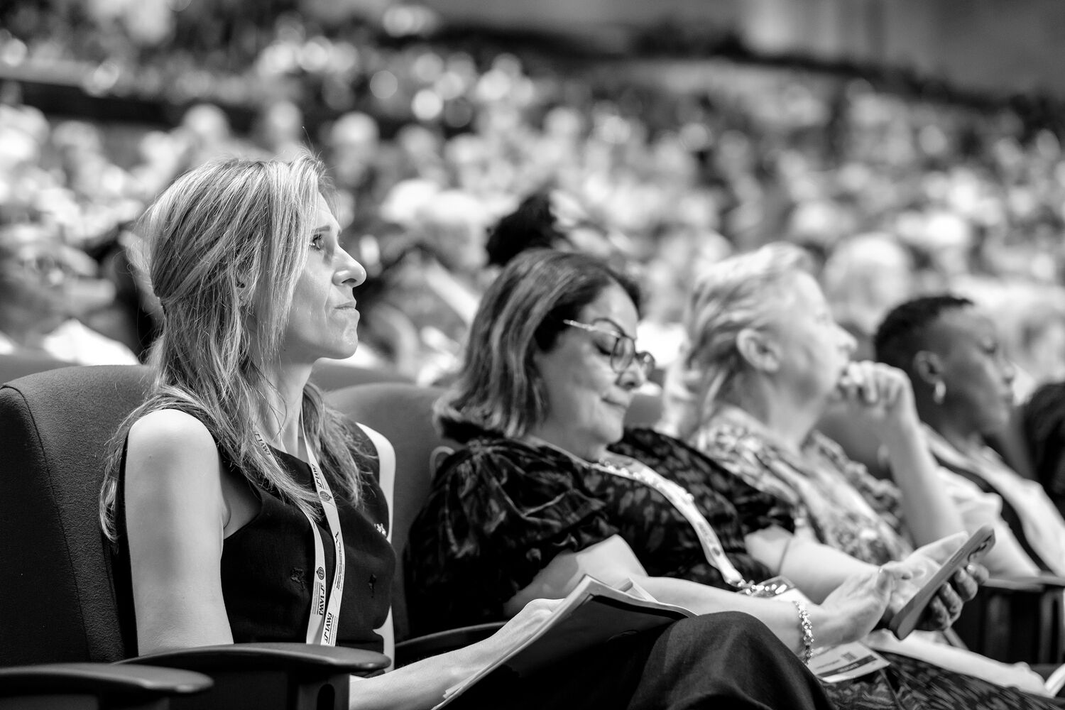 Delegates listening attentively during a session