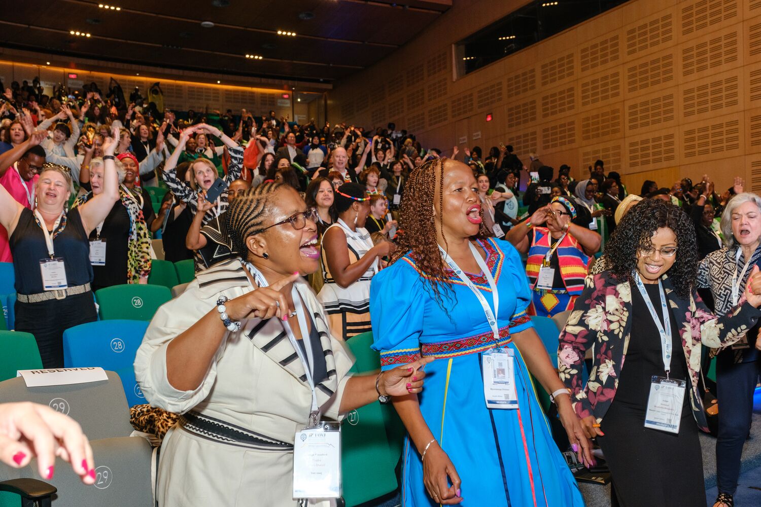 Delegates celebrating at the conference