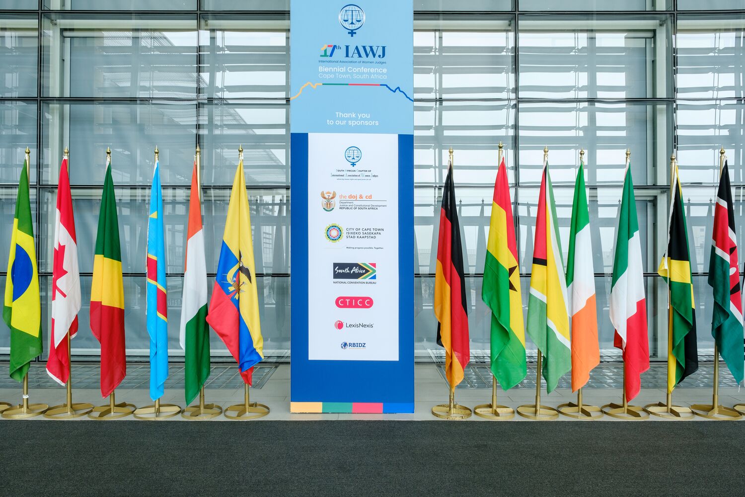 Flags of participating nations at the conference entrance