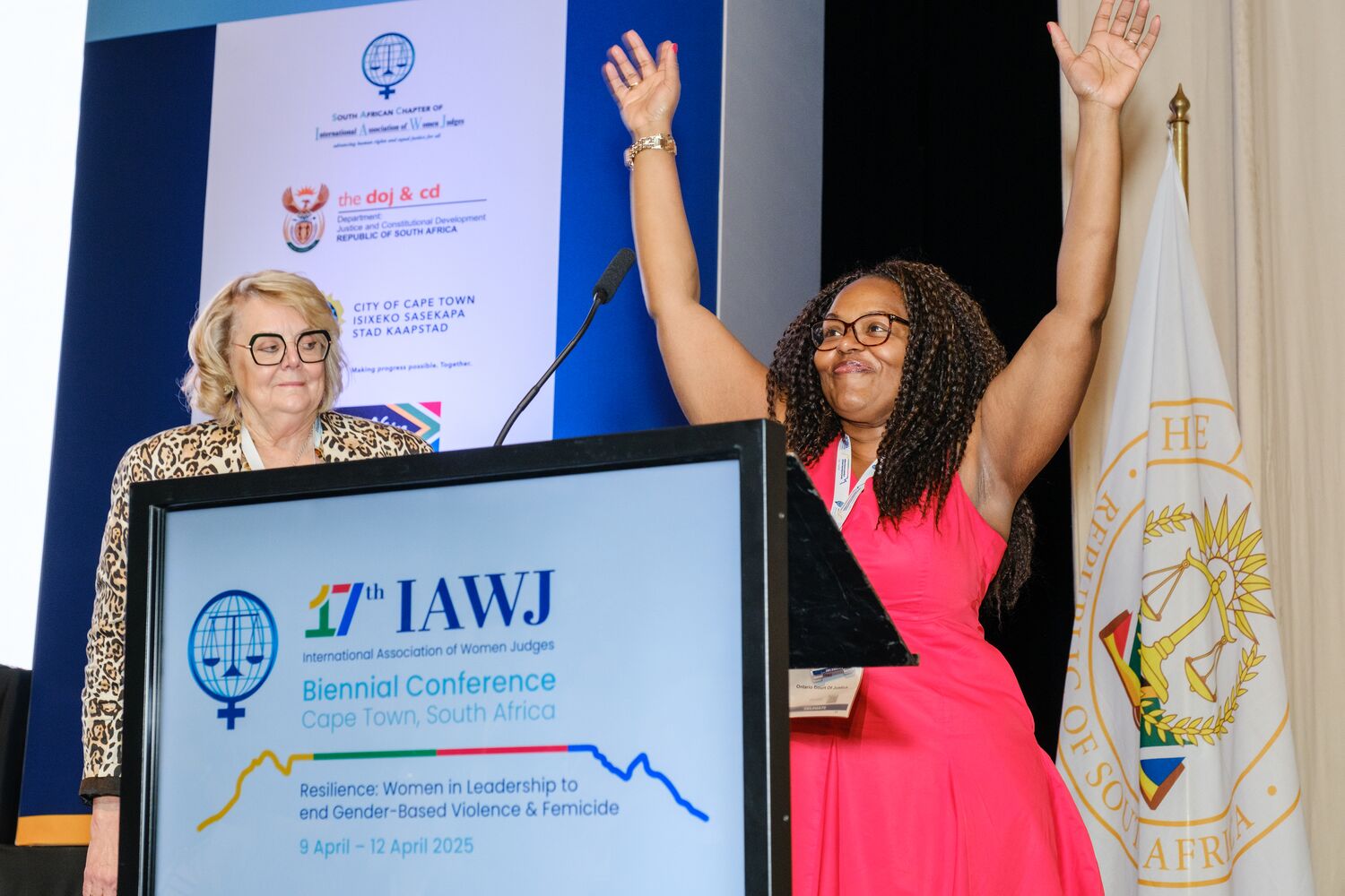 A speaker addressing delegates from the conference podium