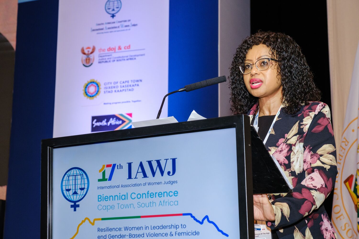 A speaker presenting during a plenary session
