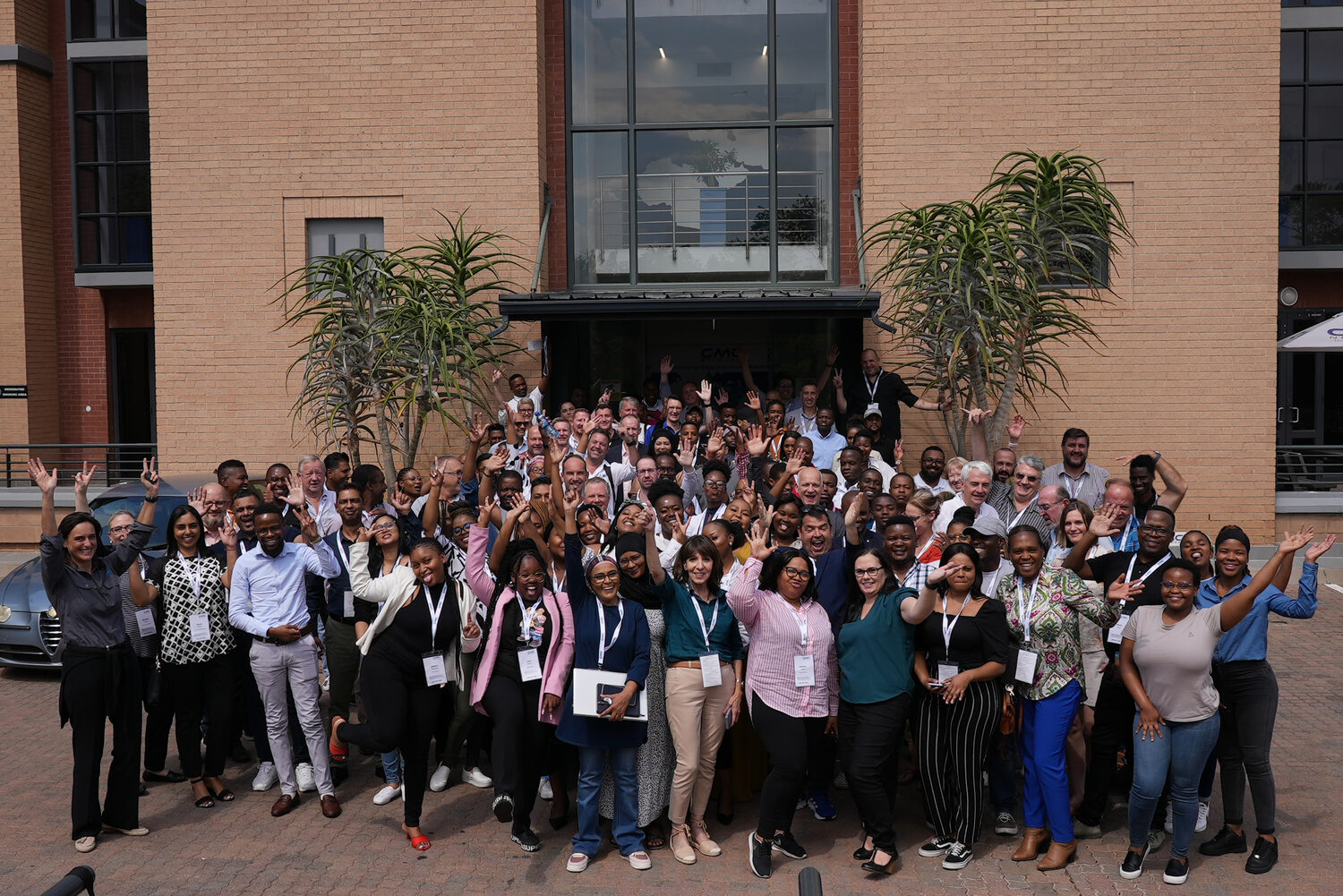 The full-company group photograph outdoors at Ignite 2024