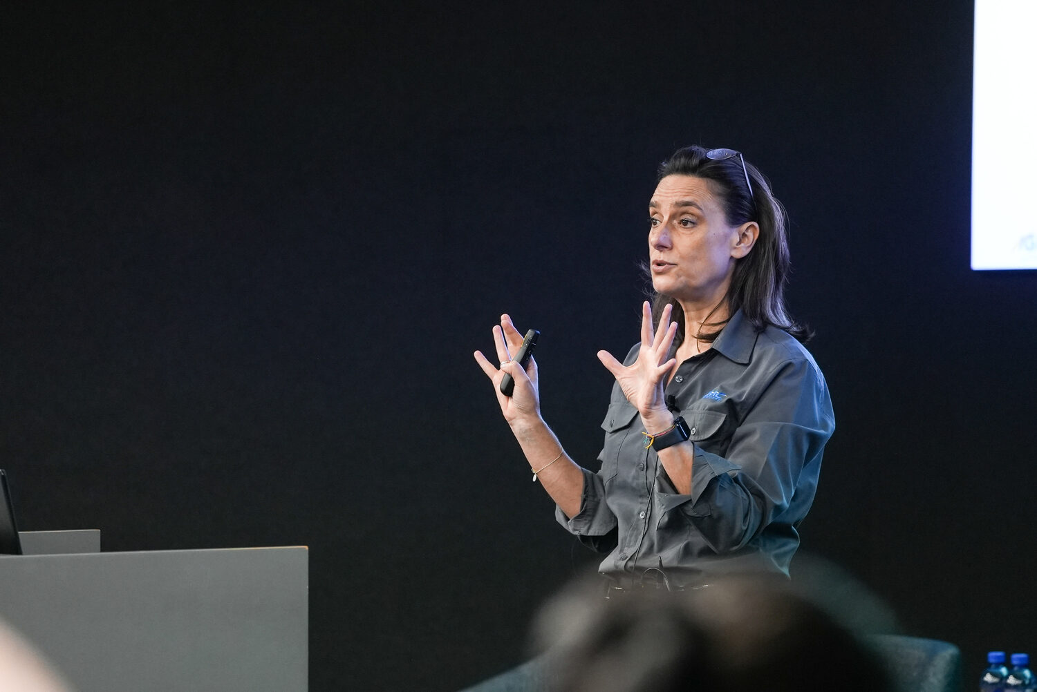 A speaker presenting on stage at Ignite 2024