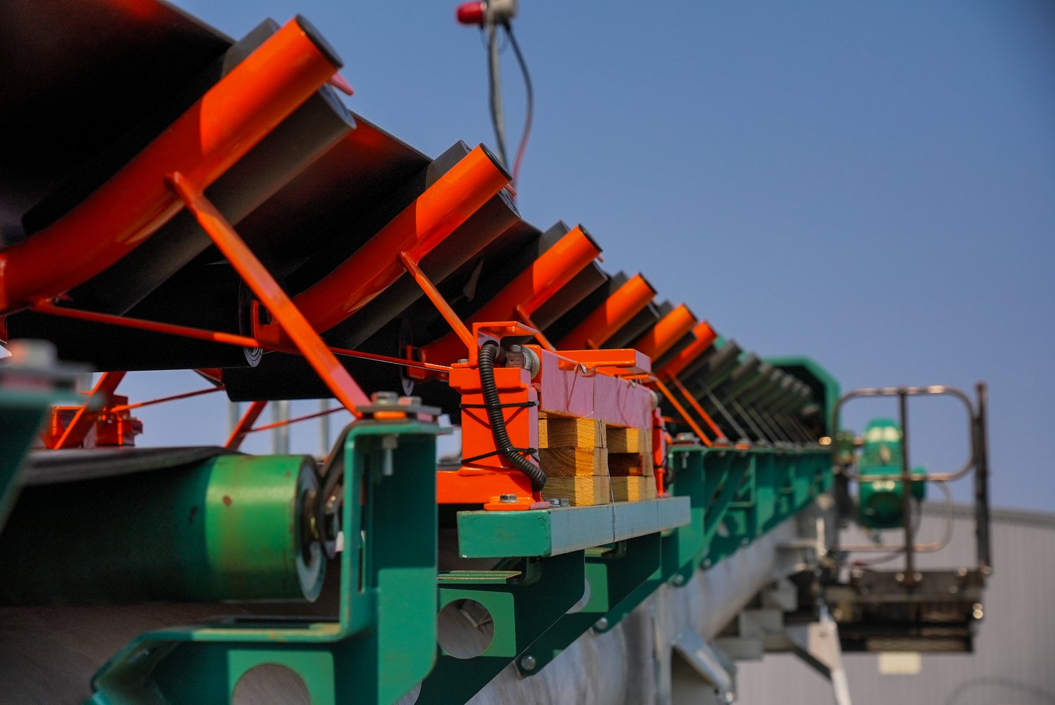Close detail of the conveyor idler rollers on the sorting plant