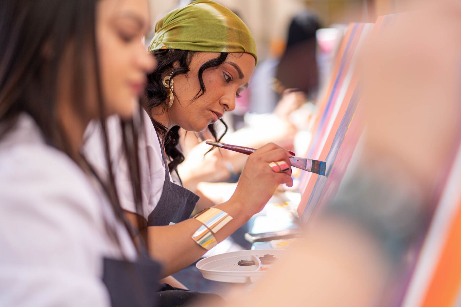 Employees creating their own version of the artwork