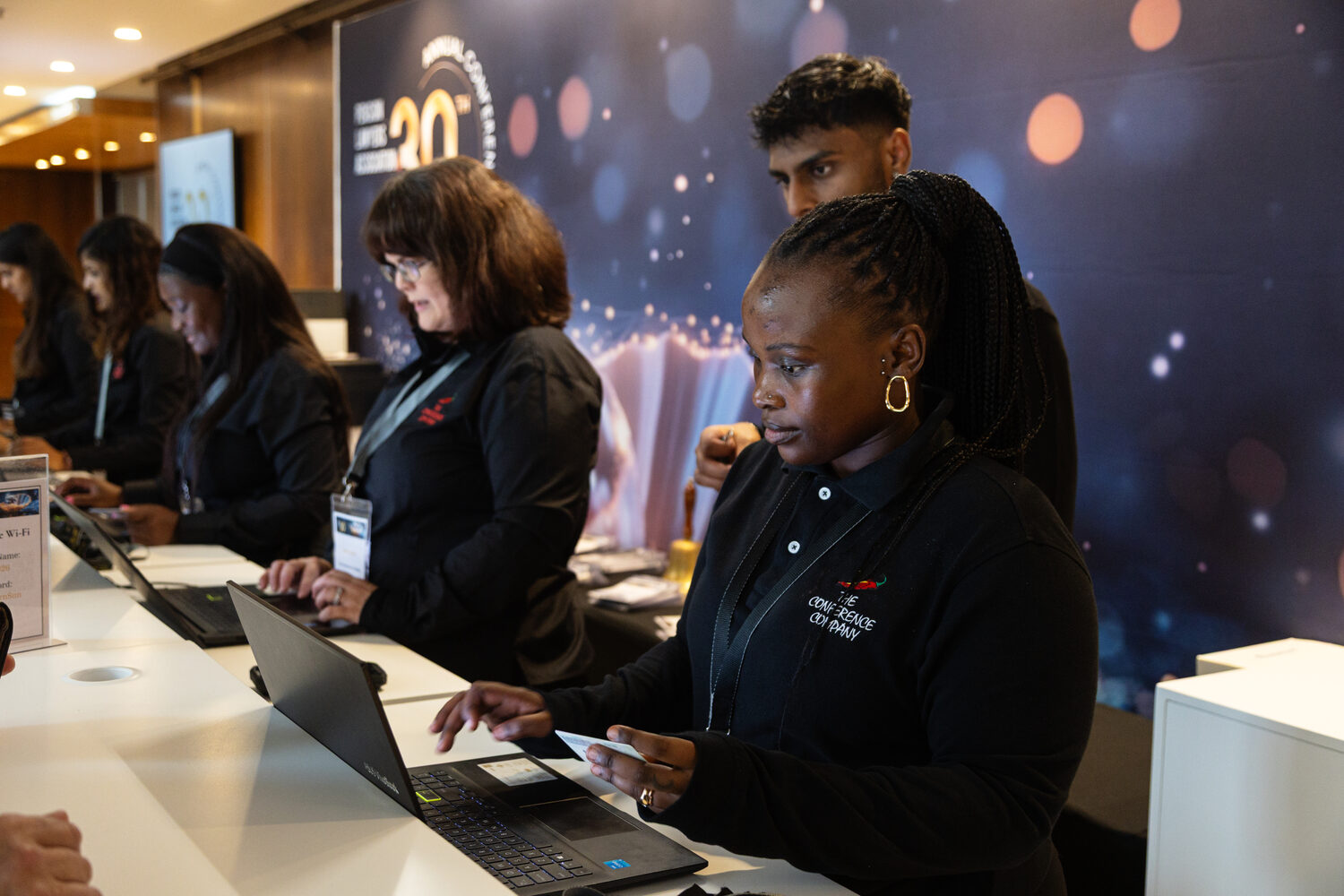 The registration desk at the anniversary event
