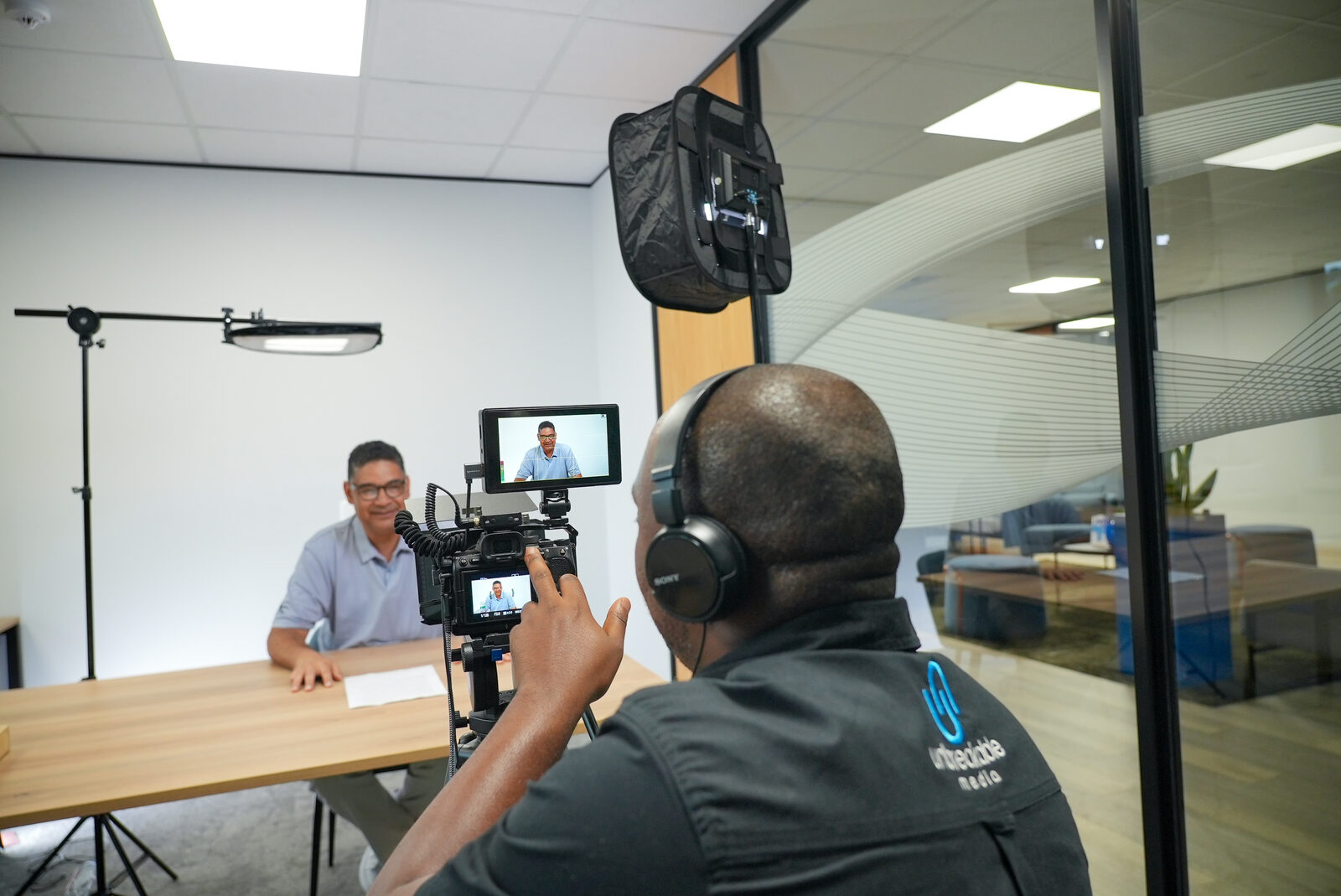 Unbreakable Media crew filming employee interviews