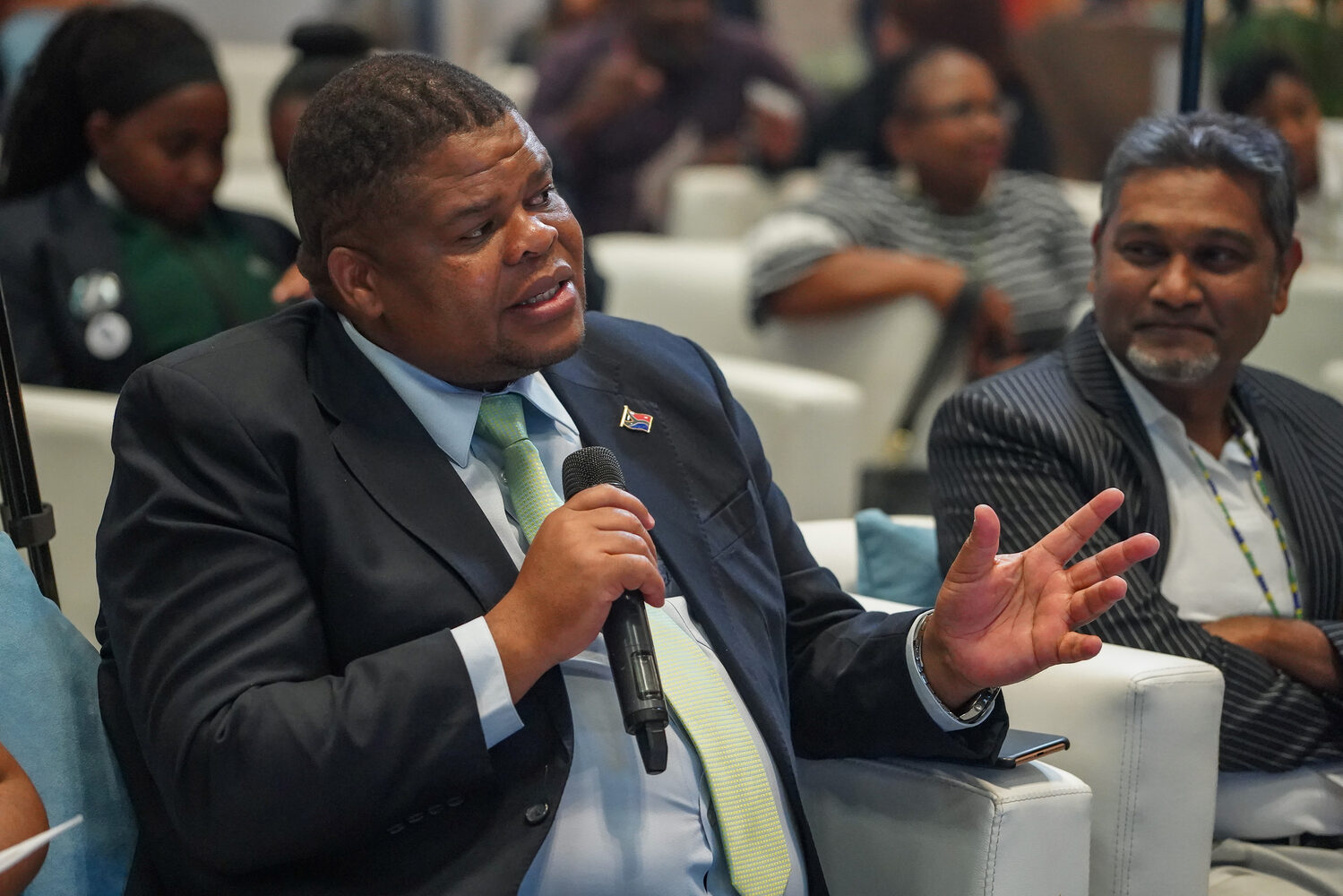 A delegate asking a question from the floor