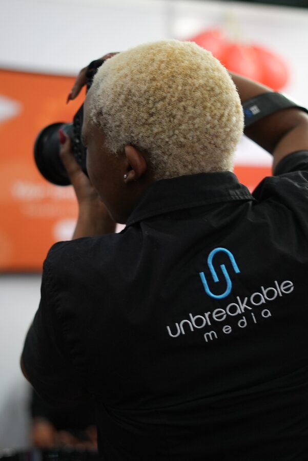 Unbreakable Media photographer shooting from within an event crowd