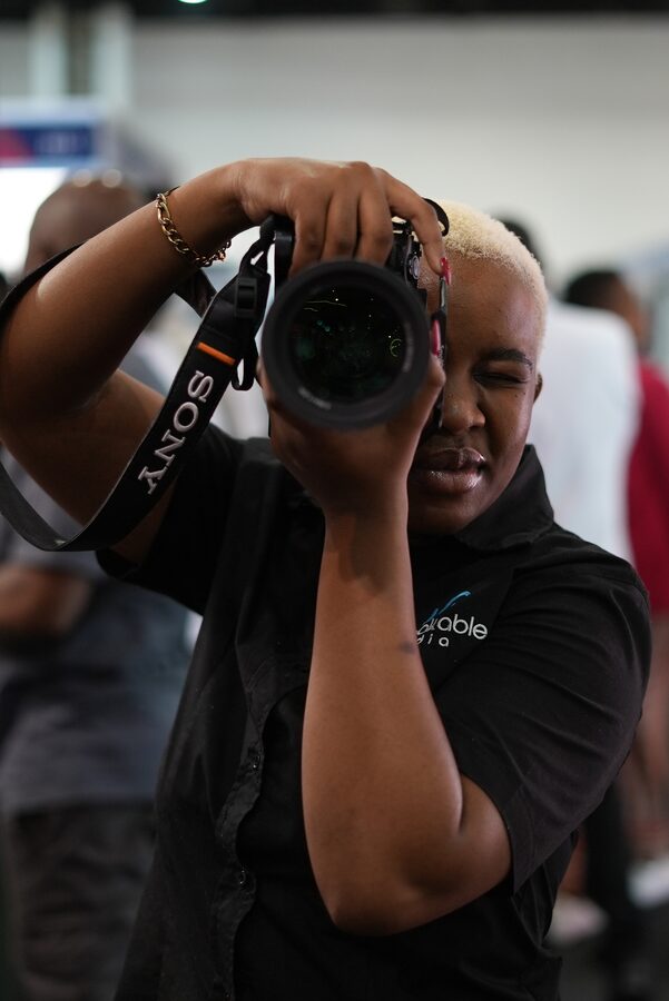 Unbreakable Media photographer framing a shot with a Sony camera